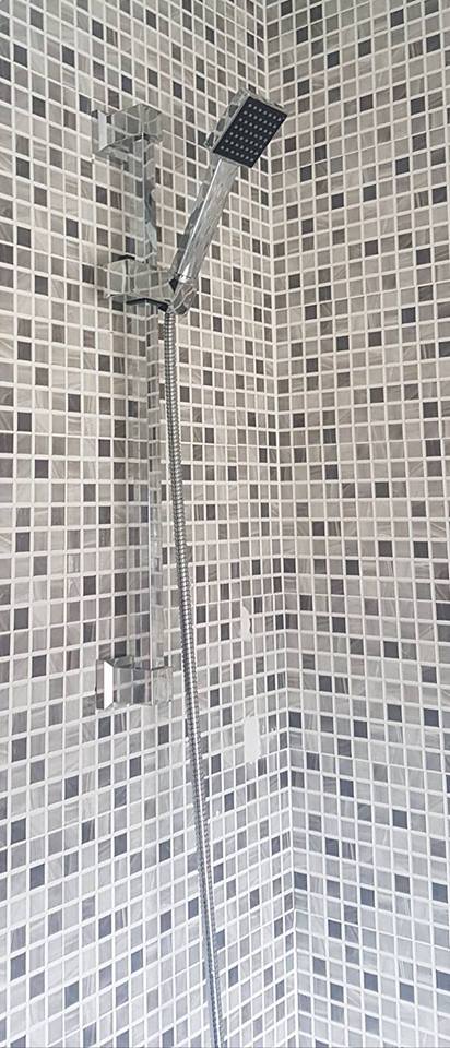 Bath tap shower wall attachment