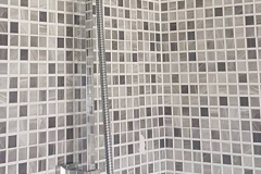 Bath tap shower wall attachment